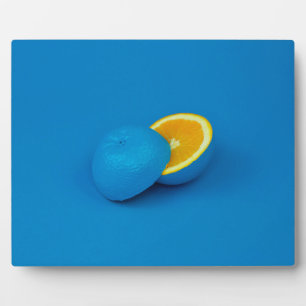 blue lemon sliced into two halves plaque