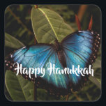Blue Morpho, Butterfly Happy Hanukkah Square Sticker<br><div class="desc">Blue Morpho butterfly shows off his brilliant,  blue wings ( 5 - 8 inches span) while resting on foliage at Butterfly Wonderland. Ready to send your Hanukkah greetings. Photo by Ruth Jolly. The text is fully customisable to meet your needs.</div>