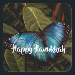 Blue Morpho, Butterfly Happy Hanukkah Square Sticker<br><div class="desc">Blue Morpho butterfly shows off his brilliant,  blue wings ( 5 - 8 inches span) while resting on foliage at Butterfly Wonderland. Ready to send your Hanukkah greetings. Photo by Ruth Jolly. The text is fully customisable to meet your needs.</div>