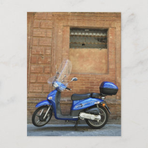 Blue motor scooter by red wall, Siena, Italy Postcard