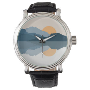 Blue mountains reflected in the lake watch