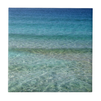 Blue Ocean Water Over White Sand Tile