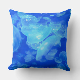 Blue ocean white jellyfish throw pillow