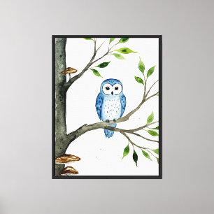 Blue owl on a tree branch canvas print