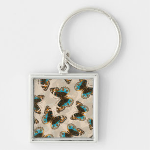 Blue Pansy Butterfly pattern on off white Key Ring