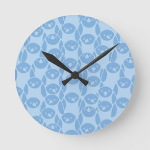 Blue penguins pattern background round clock