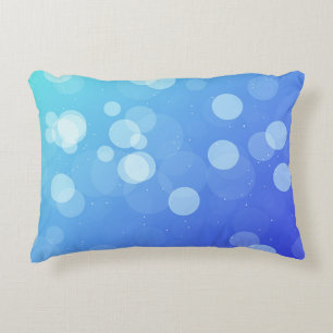 Blue pillow with abstract gradient design
