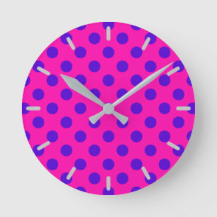 Blue polka dots on fuchsia round clock