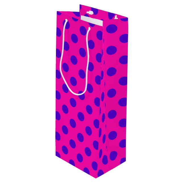 Blue polka dots on fuchsia wine gift bag (Front Angled)