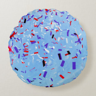 Blue, red, and black paper cutouts round cushion