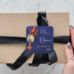 Blue red gold baubles Christmas Square Sticker<br><div class="desc">For a Christmas party favours or gift wrapping. An navy blue uneven coloured background. Decorated with red and gold baubles.  Personalise and add your name,  year.  Text: Merry Christmas</div>