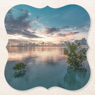 blue sky with red and dark clouds reflected on sea paper coaster