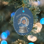 Blue Snowglobe Snowflake Photo Ceramic Tree Decoration<br><div class="desc">Adorn your Christmas tree in style with this fully customisable ornament featuring a whimsical snow globe design. The ornament showcases your personal photo in the snow globe, allowing you to capture special memories with family, pets, or friends. The background is a festive blue with a sprinkle of adorable snowflakes, creating...</div>