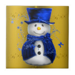 Blue Snowman on Gold Christmas Tile<br><div class="desc">A cute and colourful Christmas pattern featuring snowmen dressed in blue velvet top hat and vests,  on a festive golden background with gold stars to add a stylish and whimsical touch to your Christmas home decorations this year.</div>