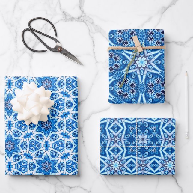 Blue snowy, wintry floral and star pattern wrapping paper sheet (Front)