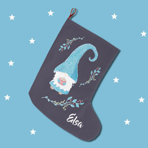 Blue Swedish gnome holding hot cocoa stocking