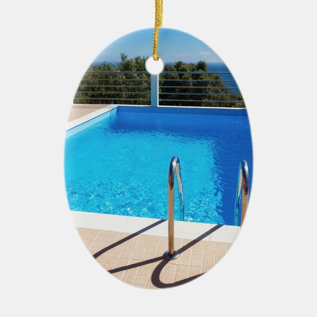 Blue swimming pool with steps at sea ceramic tree decoration (Front)