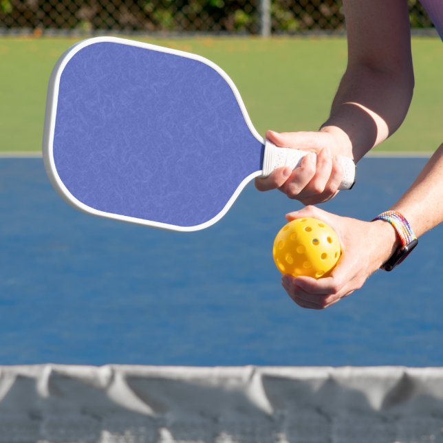 Blue textured pattern with swirling cloud pickleball paddle (Insitu)