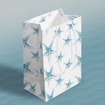 Blue Watercolor Starfish Medium Gift Bag<br><div class="desc">Beach style gift bag features a replica of my original hand painted watercolor starfish in shades of blue on a crisp white background. These gift bags coordinates beautifully with Do Tell A Belle's sea star suite. Stylish and cute, they are perfect for beach and nautical themed gifts. Small orders and...</div>