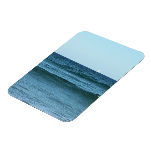Blue Waves Flowing Towards the Coast Magnet (Left Side)