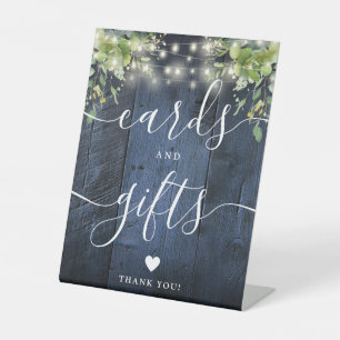 Blue Wood String Lights Greenery Cards And Gifts Pedestal Sign