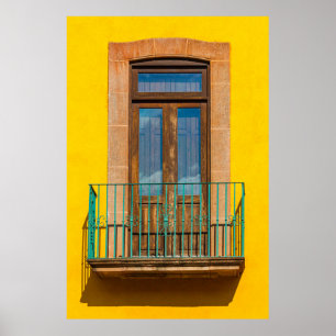 Blue wooden door on yellow concrete building poster
