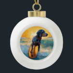 Bluetick Coonhound Beach Surfing Painting  Ceramic Ball Christmas Ornament<br><div class="desc">Immerse yourself in the playful world of canine adventure with this captivating painting. A spirited dog takes to the waves, skilfully riding the surf on a sun-kissed beach. The vibrant artwork beautifully captures the essence of beachside excitement as the dog fearlessly rides the waves, embodying the spirit of fun and...</div>