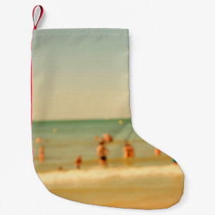 Blurred beach photo with bokeh. People relaxing on Small Christmas Stocking