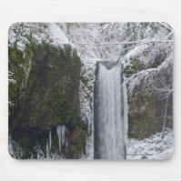 Blurry Waterfall Surrounded by a Snowy Forest