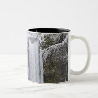 Blurry Waterfall Surrounded by a Snowy Forest