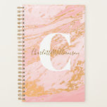Blush and Gold Marble Personalised Office Undated Planner<br><div class="desc">This stylish undated planner features a chic blush pink and faux gold marble design with a bold white monogram and elegant script name overlay. Ideal for organising school schedules, office tasks, or personal goals with a touch of glam. A perfect gift for students, professionals, or anyone who loves feminine, modern...</div>