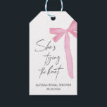 Blush Pink Bow She's Tying The Knot bridal Shower Gift Tags<br><div class="desc">Add a charming touch to your celebration with the Blush Pink Bow "She’s Tying the Knot" Bridal Shower Favour Tags! Featuring a chic bow design and customisable text,  these elegant tags are perfect for personalising favours and thanking guests in style.</div>