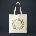 Blush pink floral wreath wedding tote bag<br><div class="desc">Blush pink floral watercolor wedding tote bag. Elegant floral watercolor design and beautiful script calligraphy. floral wreath wedding tote bag. Soft muted tones add a calm elegance to this wedding suite. edit the text to show the bride and groom names or mother of the bride,  bridesmaid,  flower girl etc</div>