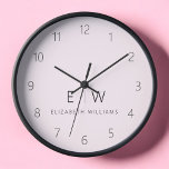 Blush Pink Modern Minimalist Monogram Name<br><div class="desc">Enhance your home decor with our Classic Elegant Modern Minimalist Monogram Wall Clock. This exquisite timepiece seamlessly combines timeless elegance with contemporary minimalism, elevating your living space to new levels of sophistication. Crafted with precision and meticulous attention to detail, this wall clock is more than just a functional accessory; it's...</div>