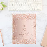 Blush rose gold glitter dust monogram name 2024 planner<br><div class="desc">A faux rose gold metallic looking background with elegant blush faux glitter dust. Personalise and add a year (upside down) and add a name. The name is written in dark rose gold with a large modern hand lettered style script with swashes. Perfect for school, work or organising your personal/family life....</div>