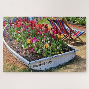 Boat filled with flowers by the lake jigsaw puzzle
