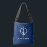 Boat Name Nautical Compass Anchor Navy Blue Crossbody Bag<br><div class="desc">Stylish navy blue crossbody tote bag with your personalised name,  boat name or other desired text. Features a custom designed nautical anchor and compass. Easily customise the base colour to match your current decor or theme. Great for vacation,  shopping and travelling. The perfect personalised gift for any occasion.</div>
