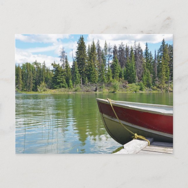 Boat tied to dock on lake postcard (Front)