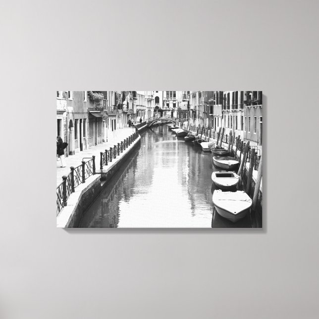 Boats along a canal in the Italian city of Venice Canvas Print (Front)