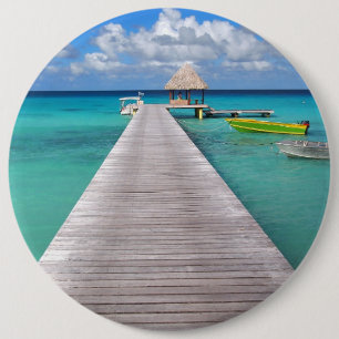 Boats at a jetty in the Pacific button