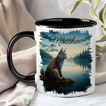 Bobcat by Lake Sunrise Wilderness  Mug<br><div class="desc">Enjoy your favourite beverage with the Bobcat by Lake Sunrise Wilderness Mug. This unique mug features a stunning design of a bobcat sitting on a rock by a serene lake at sunrise, with a beautiful forest and mountain landscape in the background. Customised with your name, it adds a special touch...</div>