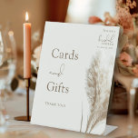 Boho Pampas Grass Bridal Shower Cards and Gifts Pedestal Sign<br><div class="desc">Boho Pampas Grass Bridal Shower Cards and Gifts Pedestal Sign. Guide your guests with style using this Boho Pampas Grass Bridal Shower Cards and Gifts Pedestal Sign. Perfect for your bohemian-themed celebration, this sign features a soft and neutral earthy colour tone and a delicate illustration of fluffy pampas grass, adding...</div>