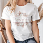 Boho Pampas Grass Roses Bride Squad T-Shirt<br><div class="desc">Get ready to celebrate the bride-to-be with this stunning Bride Squad t-shirt! Featuring a gorgeous Boho Pampas Grass and Rose design and a playful script font, this t-shirt is the perfect addition to your bridal shower party. The customisable text allows you to add your name or your bridesmaid's name to...</div>