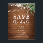 Boho Wood Greenery Script Wedding Save The Date Announcement Postcard<br><div class="desc">Save The Date features greenery leaves and string lights on rustic wood.</div>
