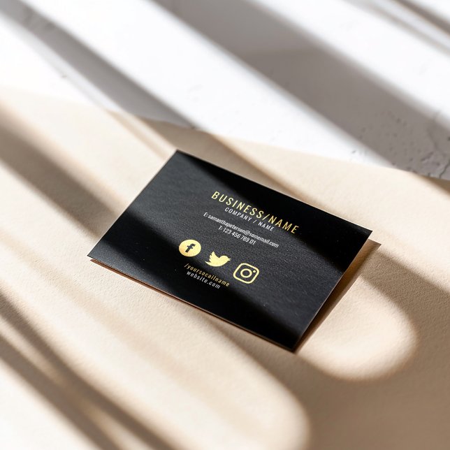 Bold black and gold social media icons luxury business card (A clean, modern business card featuring a bold black background with sophisticated gold accents)