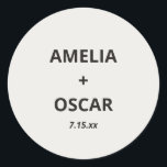Bold Black Ivory Modern Wedding Names Date Custom Classic Round Sticker<br><div class="desc">This custom wedding sticker features a soft ivory background with bold black typography of couple's names and wedding date. Customizable with your names and date. For couples who want a clean,  minimalist,  bold wedding sticker for favors or envelope seals.</div>