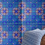 Bold Blue Red White Mosaic Geometric Pattern Tile<br><div class="desc">This ceramic tile's design is chraacterised by symmetrical patterns that create a harmonious visual effect. The tile is adorned with an array of geometric shapes, including diamonds and stars, that interlock in a complex, yet aesthetically pleasing manner. The colour palette is dominated by various shades of blue, from the cool...</div>