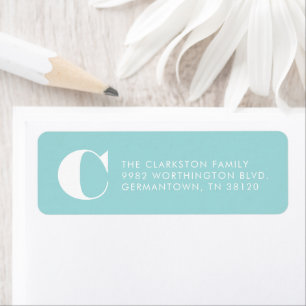 Bold initial light blue return address