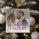 Bold Married & Merry Wedding Photo Newlywed Ceramic Ornament<br><div class="desc">Display a favorite wedding photo with this bold,  modern typography-based Christmas design,  featuring "married & merry" overlaid in red lettering joined by an oversized ampersand. Personalize with your wedding date and names. Design repeats on reverse side.</div>