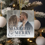 Bold Married & Merry Wedding Photo Newlywed Ceramic Ornament<br><div class="desc">Display a favorite wedding photo with this bold,  modern typography-based Christmas design,  featuring "married & merry" overlaid in navy blue lettering joined by an oversized ampersand. Personalize with your wedding date and names. Design repeats on reverse side.</div>